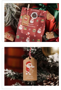 Close-up of red Christmas gift bags and kraft paper tags with festive snowman patterns