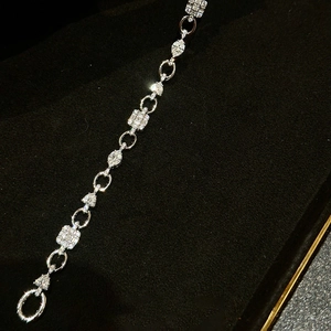 Elegant silver OT bracelet with square and teardrop zircons on black velvet jewelry box