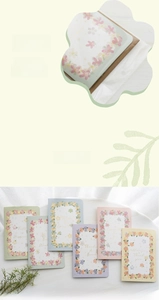 Floral pop-up greeting cards in various colors with hanging packaging for retail display