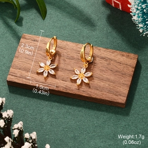 Detail shot of gold flower earrings with marquise gemstone petals and size measurements