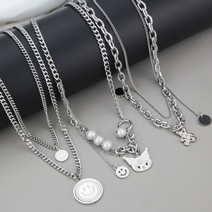 Detailed view of silver layered necklaces with Kuromi pendant and pearl charms