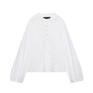 White poplin blouse featuring tiered ruffle details and puff sleeves on white background