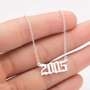 Detail of 2005 birth year pendant in gothic font on a delicate O-chain necklace