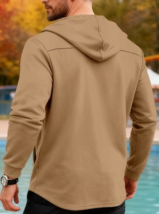 Back view of men's khaki hooded windbreaker showing detailed stitching and elastic ribbed cuffs