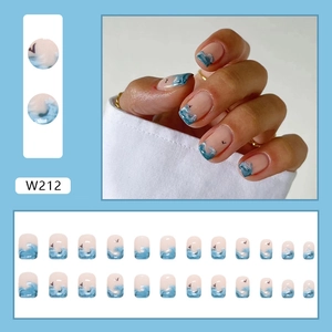 Short press on nails featuring blue ocean wave patterns and 24 piece size assortment