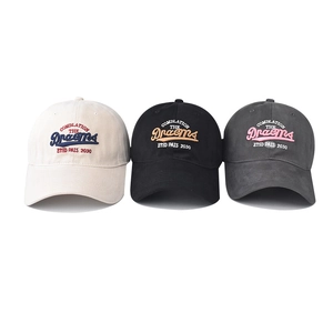 Three washed cotton baseball caps with Dream embroidery in white, black and dark grey