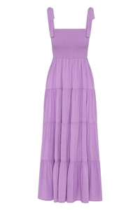 Detail of purple Swiss Dot dress showing smocked bodice and tiered ruffle skirt