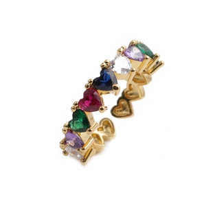 Detail of gold plated heart ring with colorful zircon stones in rainbow palette