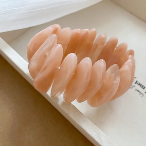 Elegant oval acrylic beaded bracelet in soft pink resin with smooth water-drop petals