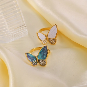 Vintage 18k gold plated butterfly rings with shell inlay and diamonds on yellow silk