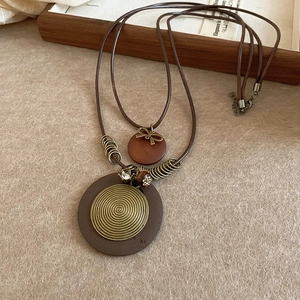 Vintage ethnic double-layer necklace with wooden circular pendant and leather cord chain