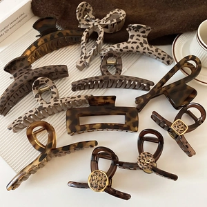 Retro leopard print claw clip set with tortoiseshell textures and vintage style patterns