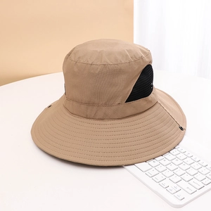Detail view of khaki sun hat featuring breathable mesh side panels and wide brim structure