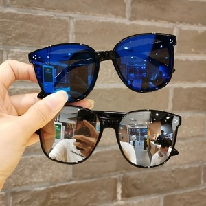 Close-up of children's square sunglasses with blue and silver mercury coated lenses
