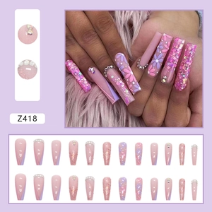 Long ballerina press-on nails in pink and purple with floral patterns and glitter rhinestones
