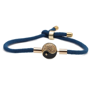 Adjustable dark blue braided Milan rope bracelet with gold Yin Yang charm and zircons