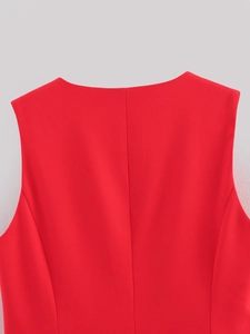 Detail of red sleeveless vest back neckline showing high-quality woven fabric texture