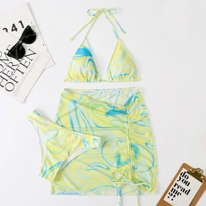 Detailed flat lay of a 3-piece bikini set with blue and yellow marble swirl pattern