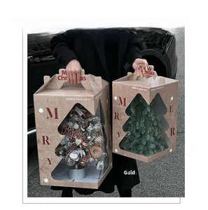Outdoor shot of a handheld Christmas tree gift box with a window and festive ornaments