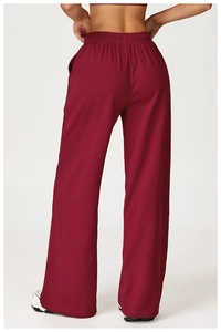 Detailed back view of burgundy high-waisted wide-leg joggers with elastic waistband