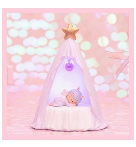 Detail of tent-shaped night light showing the sleeping angel and soft purple LED glow