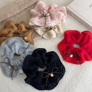 Knitted lace scrunchies with bow details in six colors on minimalist background