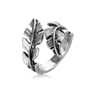 Close-up of vintage silver feather open ring with detailed antique finish texture