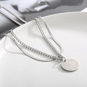 Silver double-layer snake and curb chain necklace with a round coin portrait pendant