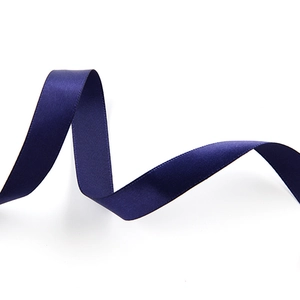 Macro shot of smooth blue double-sided satin ribbon showing silky texture and shine