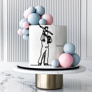 Baby shower cake topper featuring father and child line art on a white cake