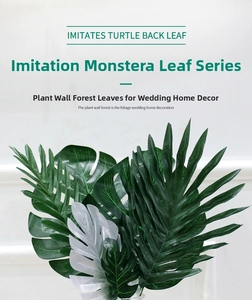 Macro detail of artificial monstera and palm leaves for wedding and home decoration