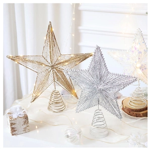 Close-up of sparkling Christmas tree topper star with metal spiral base and LED lights