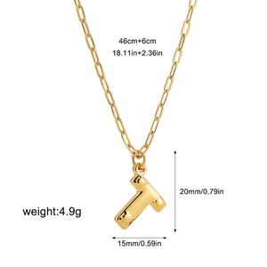 Detail of 18K gold-plated bubble letter T pendant with a polished paperclip chain