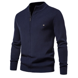 Close-up of navy blue ribbed knit cardigan with full zipper and stand collar detail