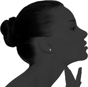 Minimalist silver cross stud earring displayed on an elegant female profile silhouette