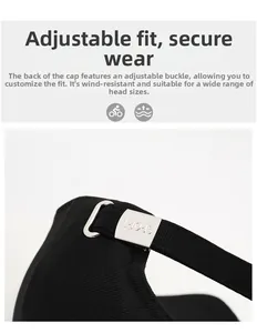 Detail of adjustable metal buckle with SPORT engraving on black baseball cap rear