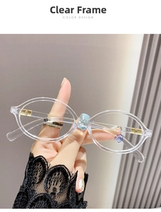 Détail de lunettes ovales transparentes anti-lumière bleue avec charnières dorées