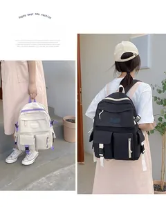 Dual view of large capacity canvas backpacks in cream and black with multiple pockets