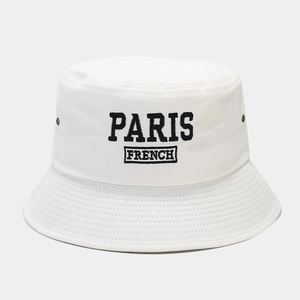 Detailed close-up of PARIS embroidery and metal eyelets on a white cotton bucket hat