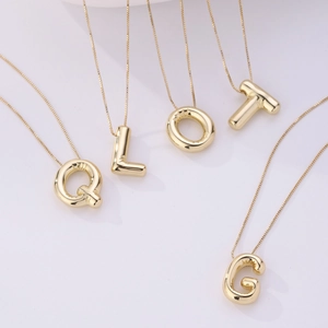 3D balloon letter pendant necklace in 18K gold plated finish with polished minimalist chain
