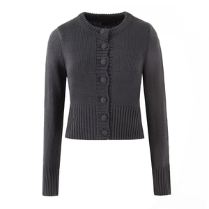 Detailed view of dark gray knit cardigan featuring fine ribbing and button-up front closure