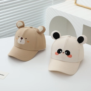 Close-up of kids animal baseball caps with bear and panda embroidery and 3D ears