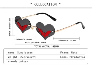 Detail view of heart-shaped bat sunglasses with golden metal frame and size dimensions