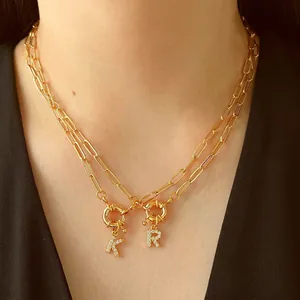 Chic layered gold chain necklace featuring zircon paved letter K and R charms for women