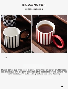 Detail of artistic ceramic mugs with bold vertical stripes and large round geometric handles