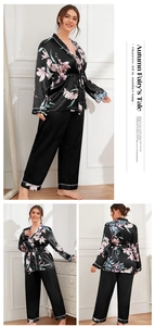 Detail of floral satin pajama set showing kimono wrap top and relaxed pants in black