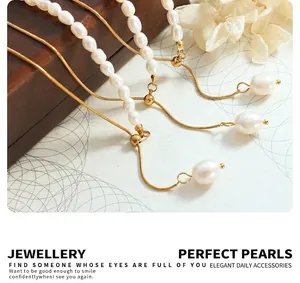 Detail of gold snake chain bracelet with white baroque pearls and adjustable slider clasp