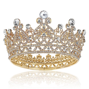 Baroque gold bridal crown with sparkling crystals and rhinestones on a white background