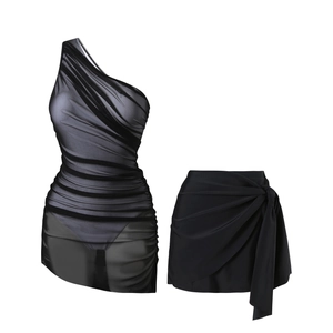 Detail of black one-shoulder mesh swimsuit with side-tie wrap skirt and ruched texture