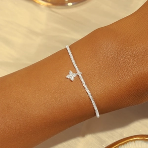 Macro detail of S925 sterling silver clover bracelet with sparkling moonstone accents
